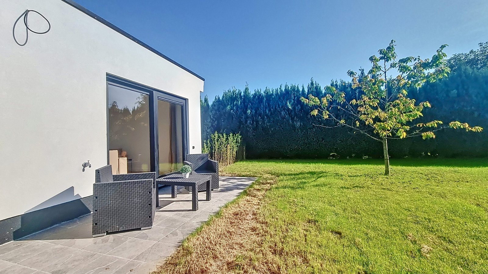 Greenery of a beautiful villa with a resting space , led by CG permits - architectural services